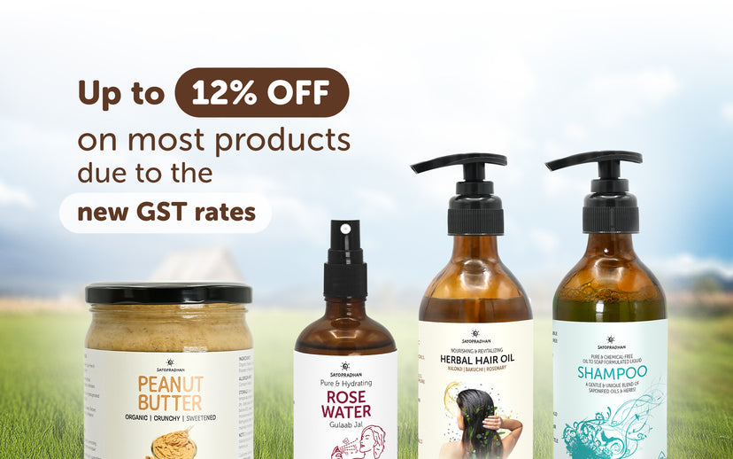 Cosmetic products with a promotional banner for GST rate changes on a scenic background
