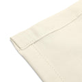 Close-up of the corners of an organic cotton handkerchief, cream white, eco-friendly, and neatly stitched