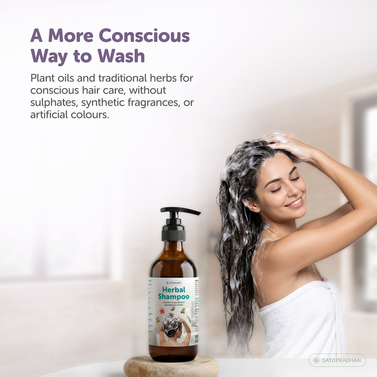 Satopradhan Herbal Shampoo displayed beside a woman washing her hair, promoting plant-based hair care with traditional herbs and without sulphates, synthetic fragrances, or artificial colours.