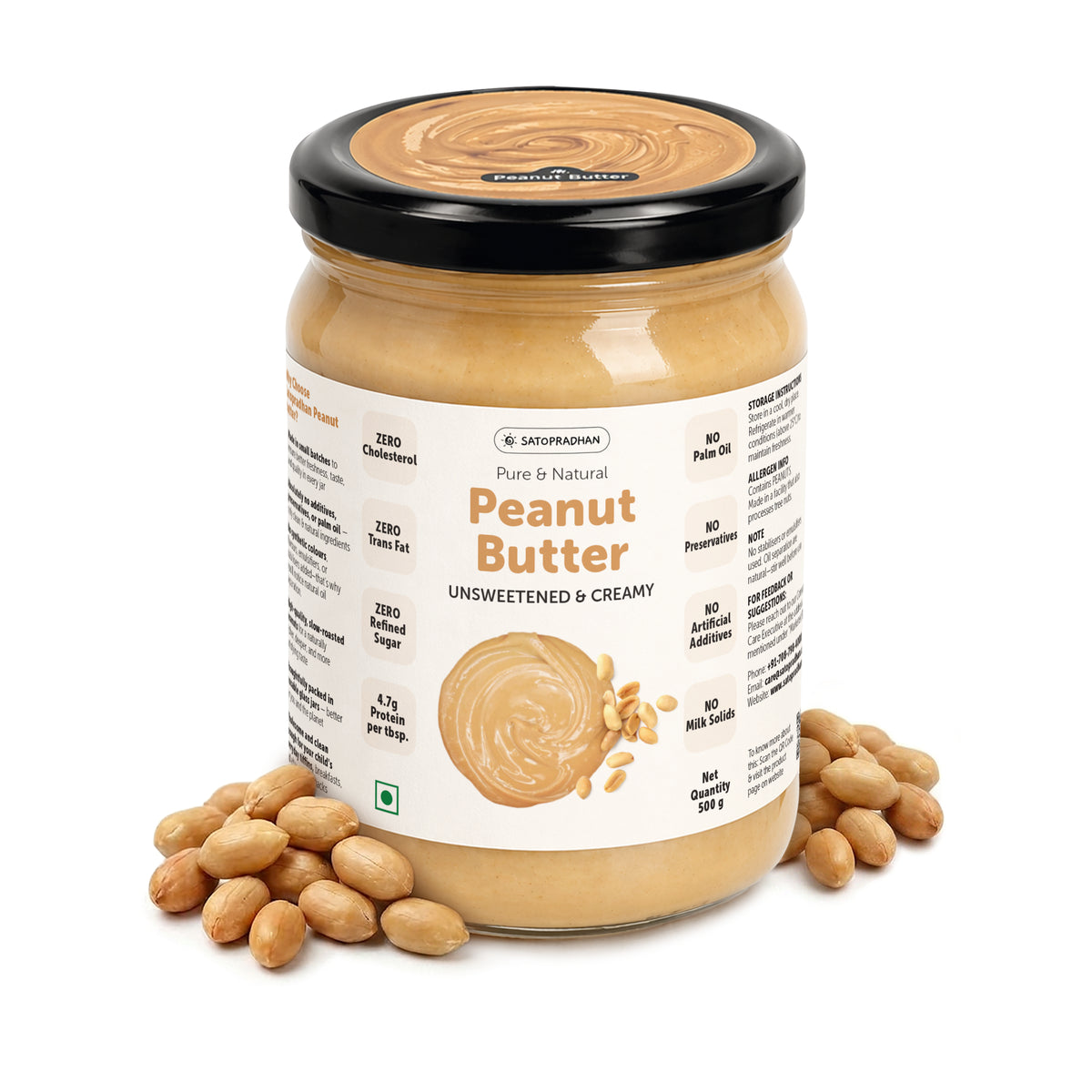 Satopradhan unsweetened creamy peanut butter in a glass jar with black lid and natural peanuts on a white background.