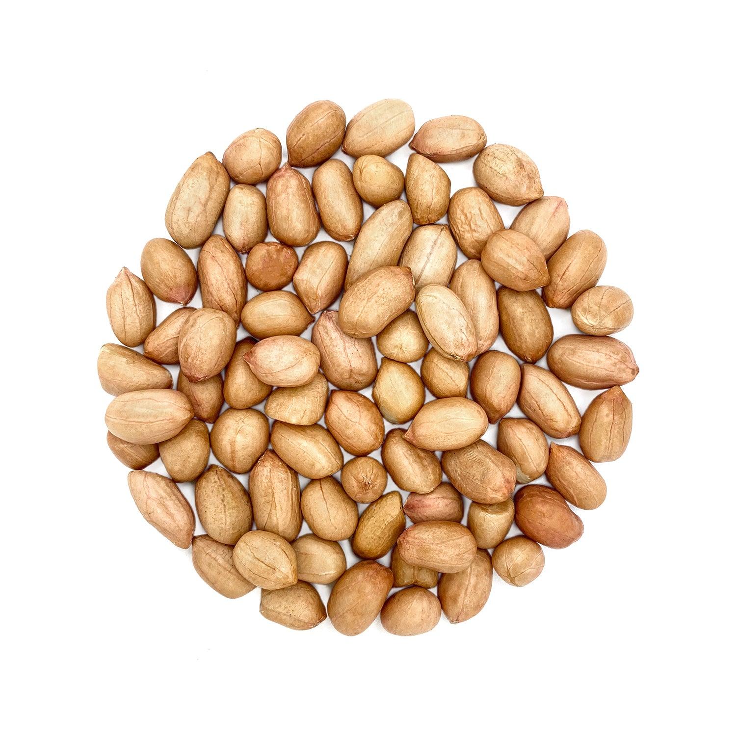 A circular arrangement of whole, unshelled peanuts displayed against a white background. The peanuts are natural in color and appear clean and fresh, highlighting their unprocessed state. This image visually emphasizes the simplicity and purity of the peanuts, suitable for various culinary uses